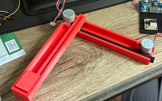 The 3D-printed two-axis mechanism assembled, with stepper motors mounted at each axis